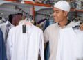 Man wearing white thobe. Traditional thobes for men in various colors and styles. Perfect for special occasions or everyday wear.