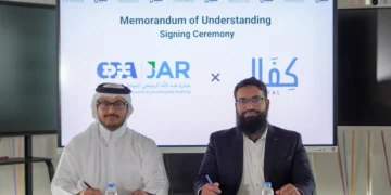 epresentatives of JAR Accounting & Auditing and Kifal sign a memorandum of understanding at a ceremony table, with both companies’ logos displayed on a screen behind them